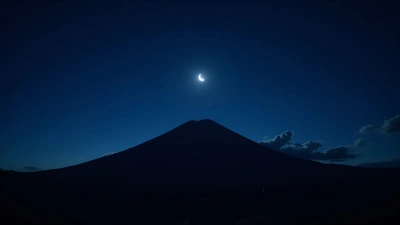 Black Mountain Peak Under Starry Night Sky
