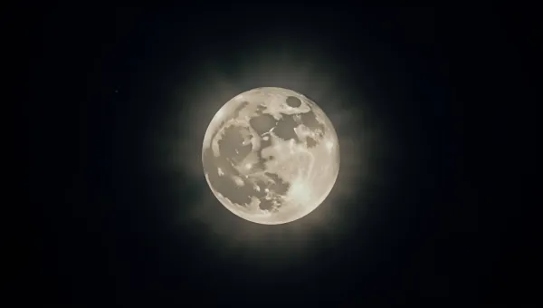 Bright Full Moon Illuminating Dark Night Sky