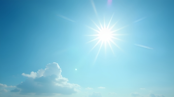 Bright sunlight casting soft shadows under a clear blue sky on a warm day