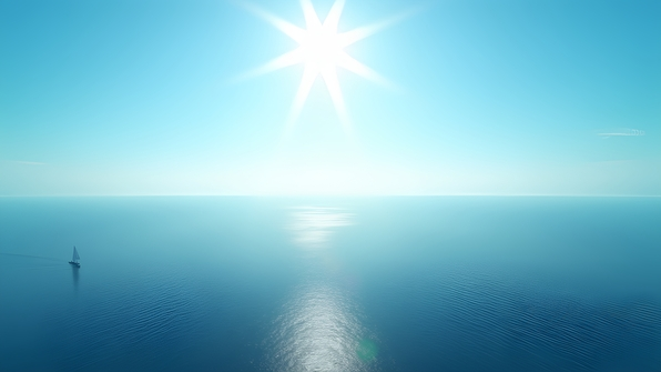 Vast calm ocean beneath a bright clear blue sky with gentle sunlight reflecting off the serene water surface