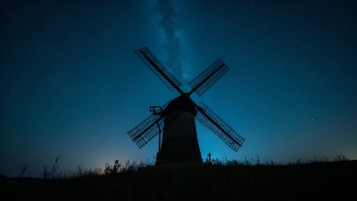 Classic Windmill Silhouette Under Starry Night Sky