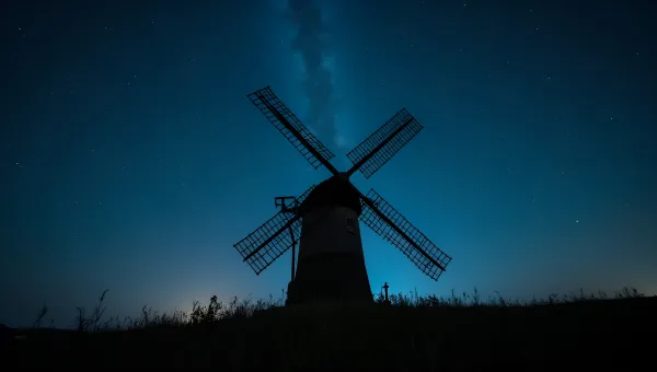 Classic Windmill Silhouette Under Starry Night Sky