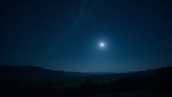 Clear night sky with bright stars twinkling over a dark serene landscape illuminated by soft moonlight