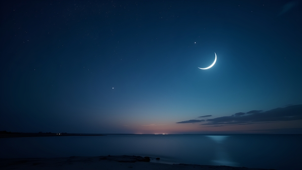 A clear night sky with twinkling stars over a calm landscape