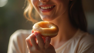 Close-Up Glazed Doughnut Held By Woman