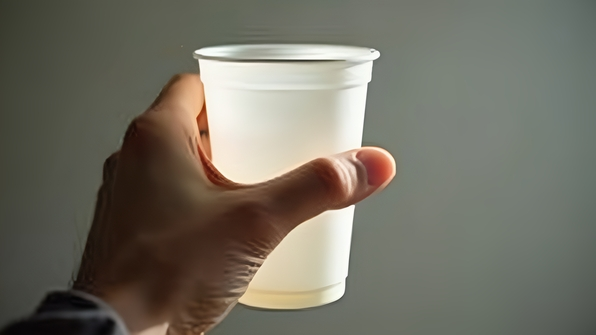 Close-Up Hand Holding White Plastic Cup