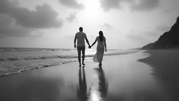 Couple Walking Hand in Hand on Sandy Beach