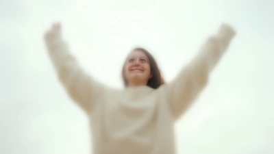 Cozy White Sweater Person Raising Hands Joyfully