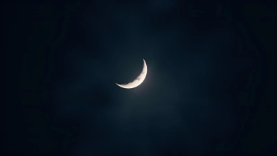 Crescent Moon Glowing Softly At Night