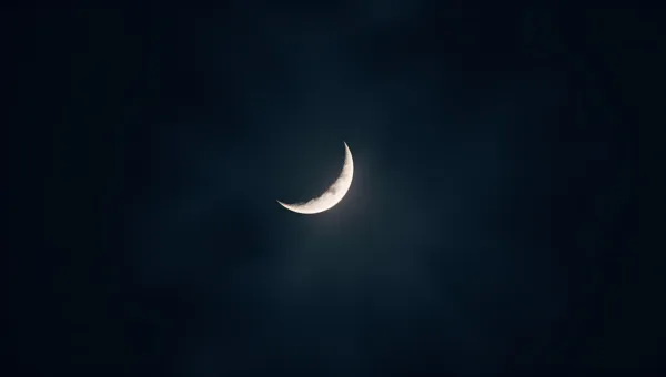 Crescent Moon Glowing Softly At Night