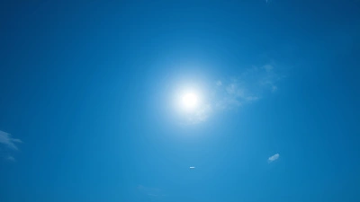 Full Moon Glowing Softly In Blue Sky