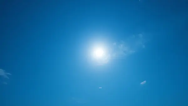 Full Moon Glowing Softly In Blue Sky