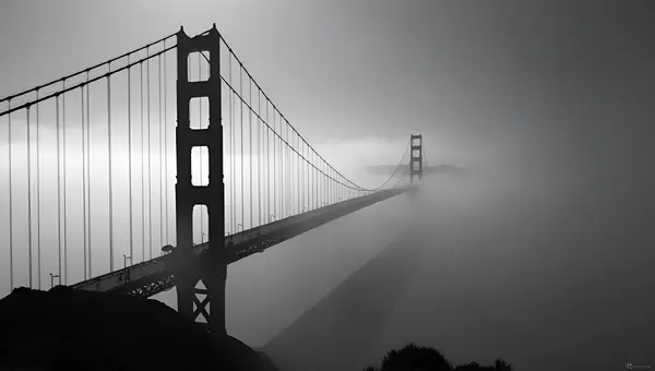 Golden Gate Bridge In Fog With Moody Sky