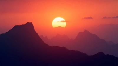 Jagged Mountain Peaks Silhouette At Sunset