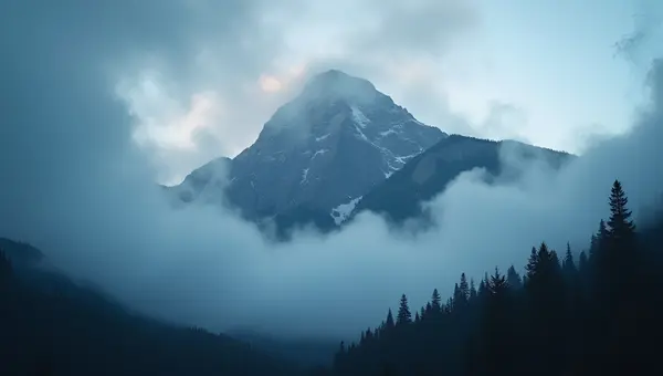Majestic Mountain Peak in Foggy Forest