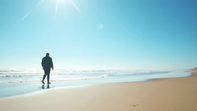 Man in Black Jacket Walking Beach