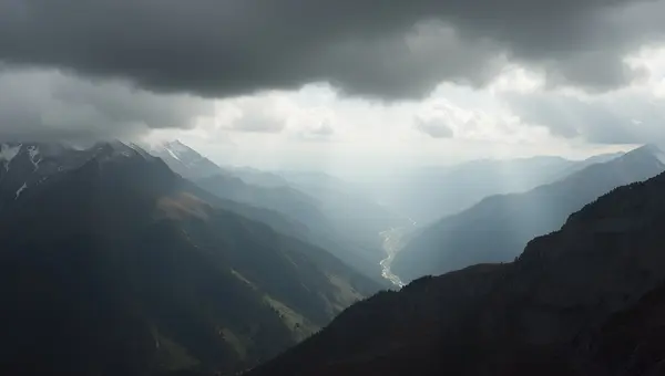 Monochrome Mountain Range Under Overcast Sky