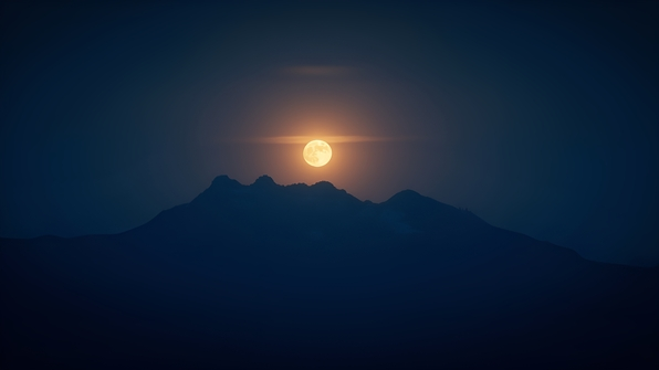 A dramatic silhouette of a mountain range beneath a large, glowing full moon in a clear night sky