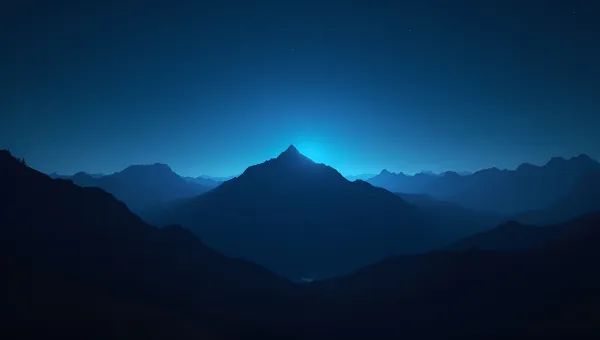 Mountain Range Silhouette Under Starry Night Sky