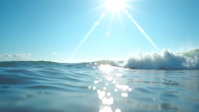 Ocean Waves Crashing On Shore Under Blue Sky