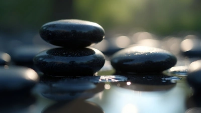 Polished Black Stones Close-Up On Reflective Surface