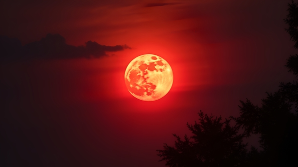 Red Full Moon Glowing Brightly At Night