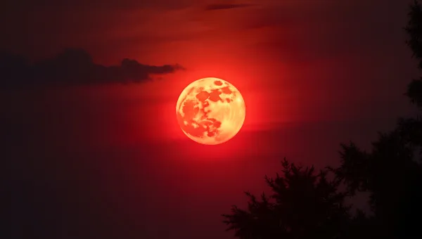 Red Full Moon Glowing Brightly At Night
