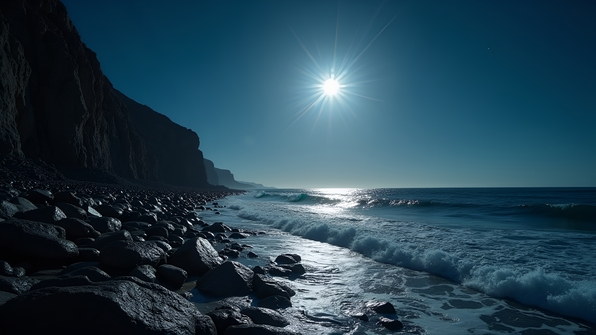 A rugged rocky shoreline under a bright full moon reflecting on gentle ocean waves at night