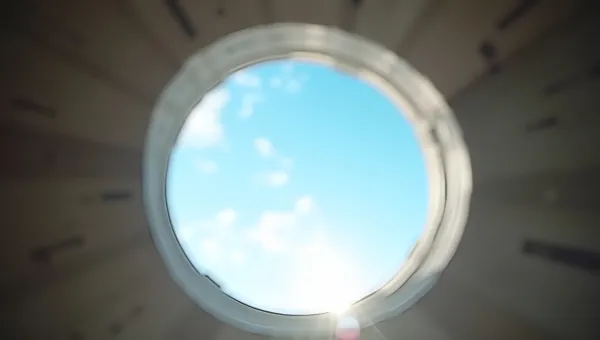 Round Window Frame View Of Blue Sky