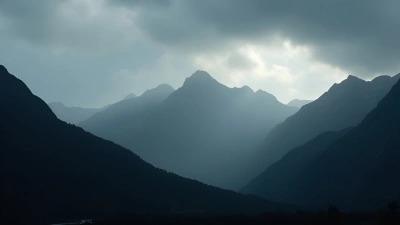 Rugged Mountain Range Silhouette Under Overcast Skies