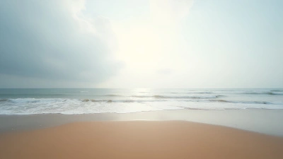 Serene Sandy Beach With Gentle Waves