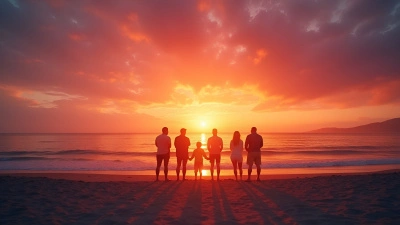 Silhouetted Figures On Sandy Beach At Sunset