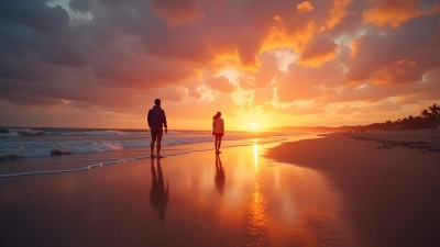 Silhouetted Figures Walking On Sandy Beach At Sunset