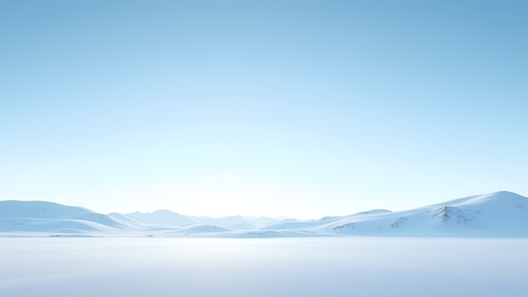 Vast snow covered field under clear blue sky with soft shadows and distant trees on the horizon
