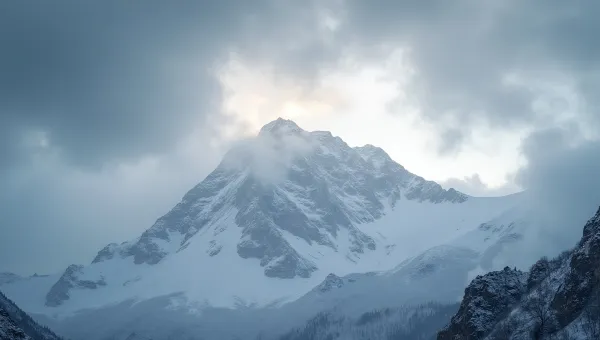 Snow-Covered Mountain Under Overcast Sky