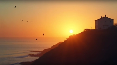 Sun Setting Behind Hilltop Building Over Sea