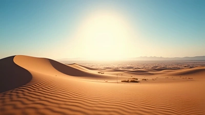 Sunlit Sand Dunes Under Clear Blue Sky
