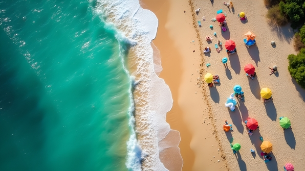 A vibrant aerial view of a sunlit sandy beach with turquoise waves gently lapping shorelines