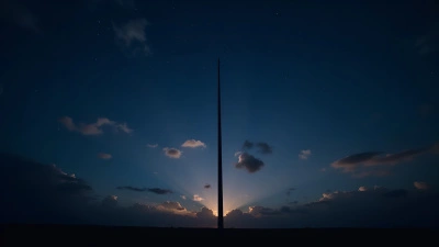 Tall Pole Silhouette Against Starry Night Sky