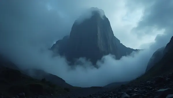 Towering Mountain Under Dense Dark Clouds