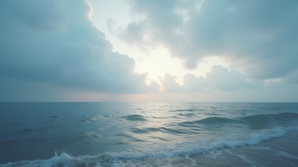 Soft-focus image of vast ocean meeting cloudy sky at tranquil horizon