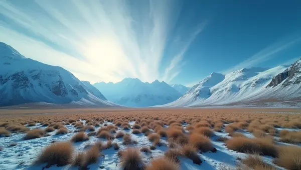 Vast Tundra Landscape With Snow-Covered Mountains