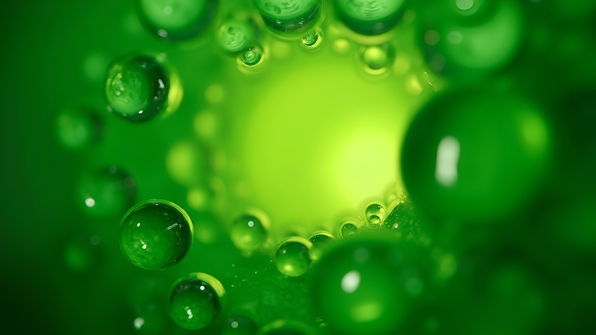 Close-up macro shot of vibrant green bubbles with sharp details and translucent reflections