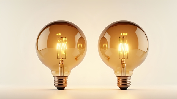 Vintage-style light bulbs with brown tinted glass and clear filament on white background