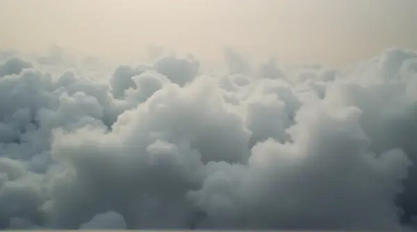Close-up of vapor formations showing intricate textures and gentle gradients on a muted background.