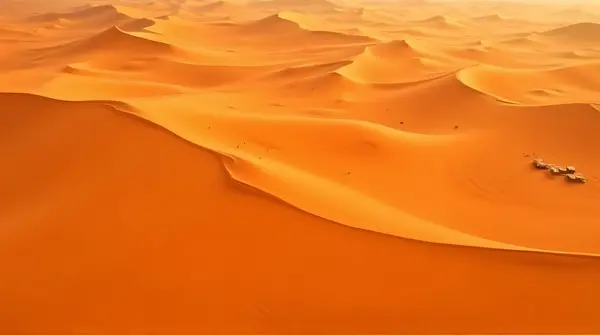 Aerial View Of Expansive Ochre Sand Dunes