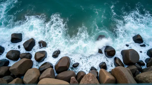 Aerial View Foamy Sea Surging Granite Boulders