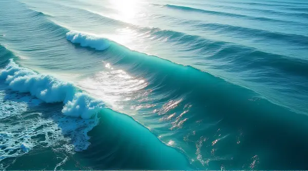 Aerial View Of Ocean Waves With Sunlight Reflection