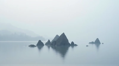Angular Stone Structures Reflecting On Lake