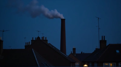 Brick Chimney Emitting Smoke Against Indigo Sky
